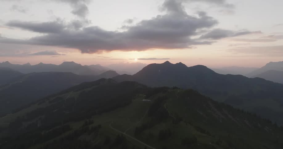 Mountain range landscape with sunset on the horizon