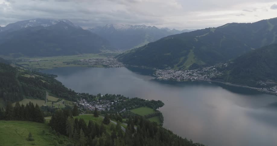 Lake surrounded by mountains and a town along its shores