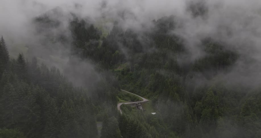 Aerial landscape on a foggy day with mountains and forest