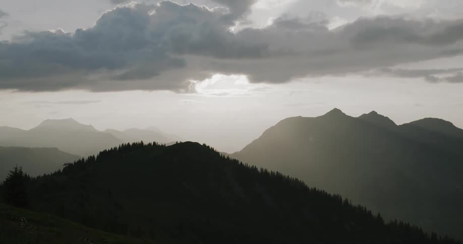 Panorama of mountains silhouette against a dawn sky