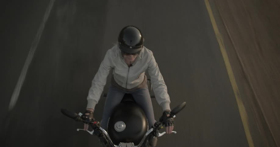 A man rides a motorcycle