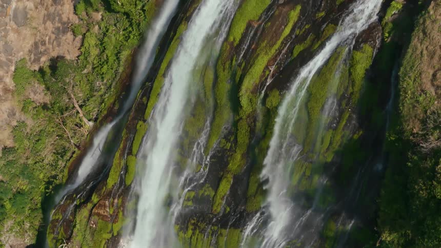 Waterfall on rocks with freefalling mosses