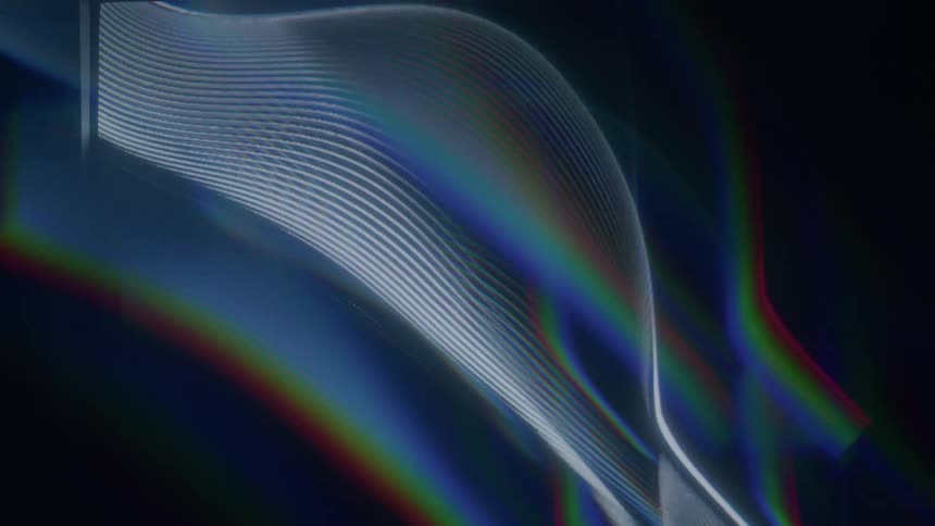 Black background with the projection of colorful and abstract lines in motion