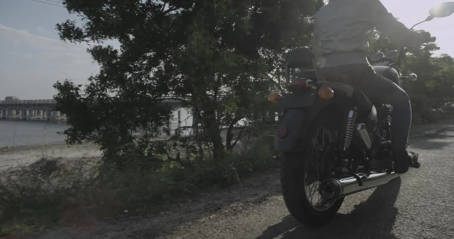 A woman rides a motorcycle