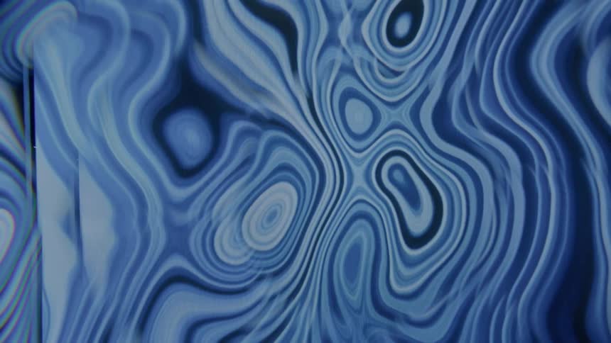 Various shades of blue form layers and circular shapes in morphing screensaver animation