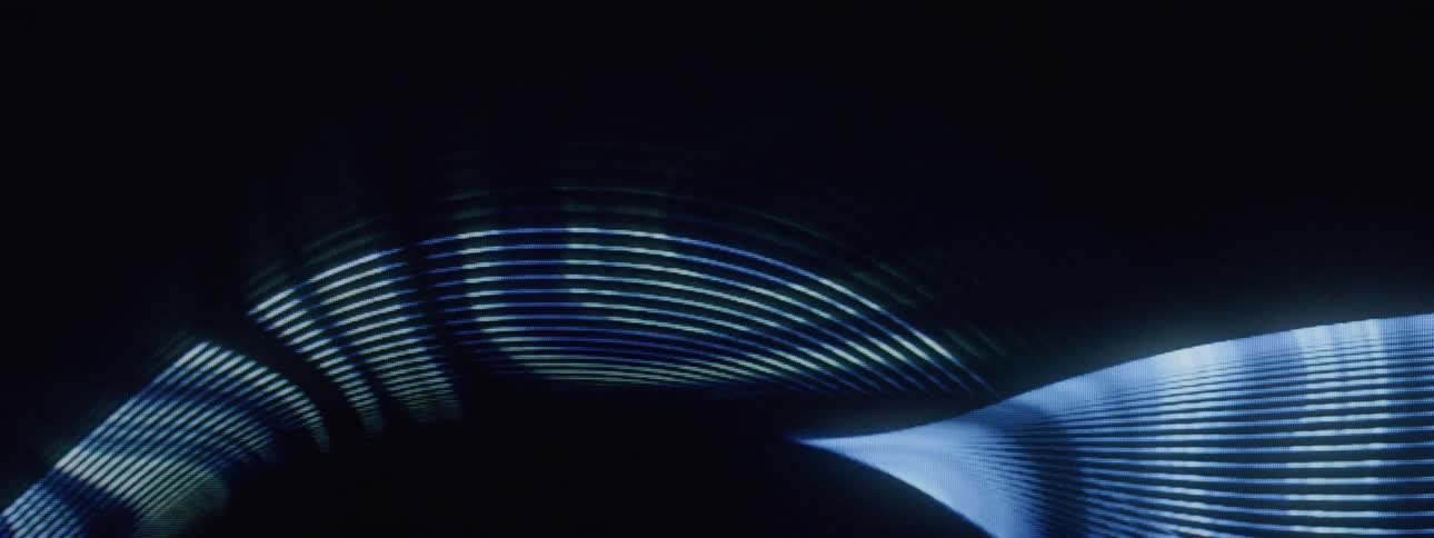 Abstract pattern of wavy moving blue lines on a dark background