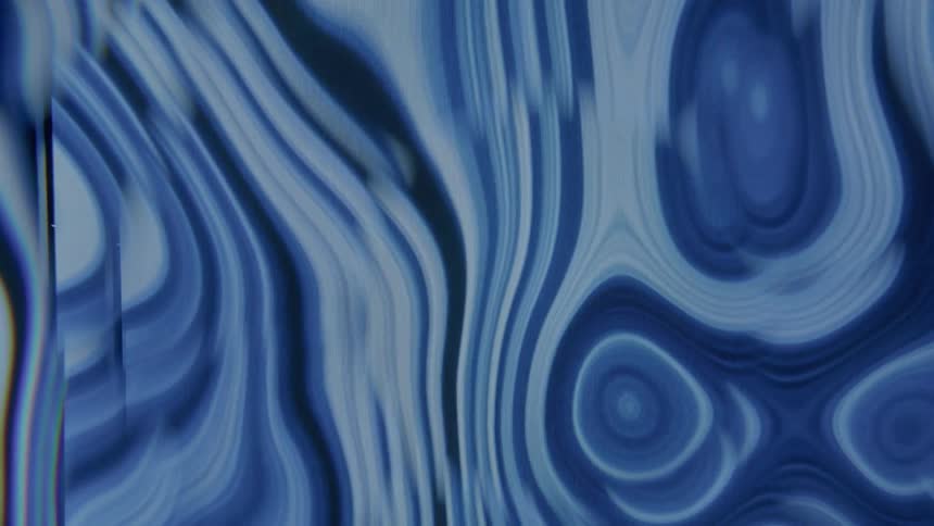 Blue liquid pooling in and out itself creating multiple layers
