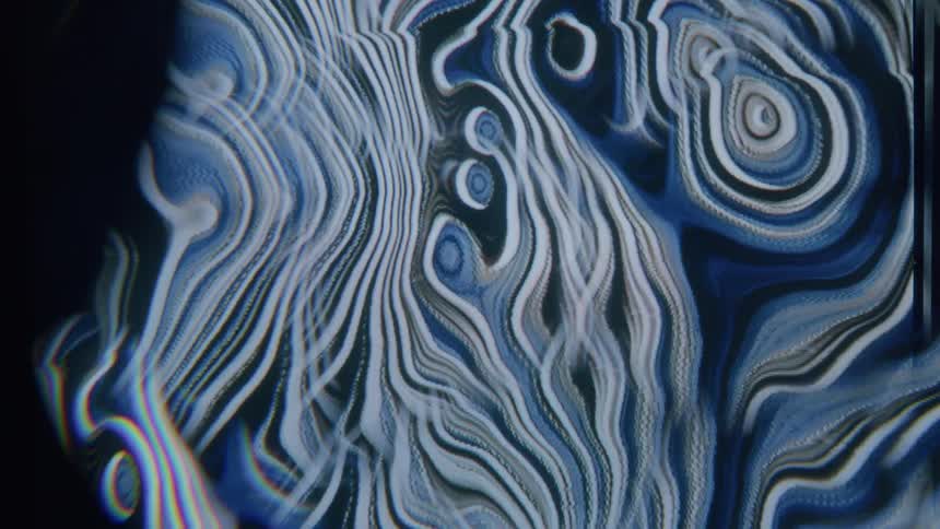 Pattern of abstract blue lines against a flowing black background