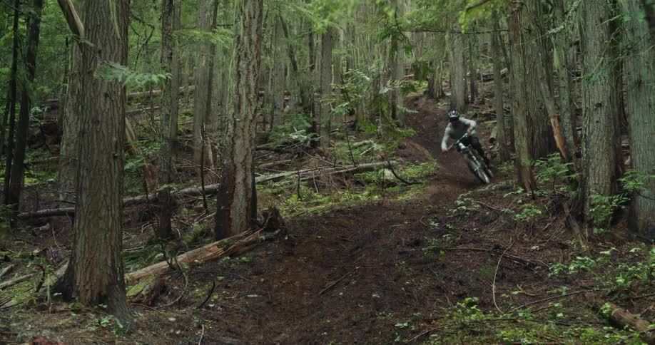 Person descends a steep section of trail on their mountain bike