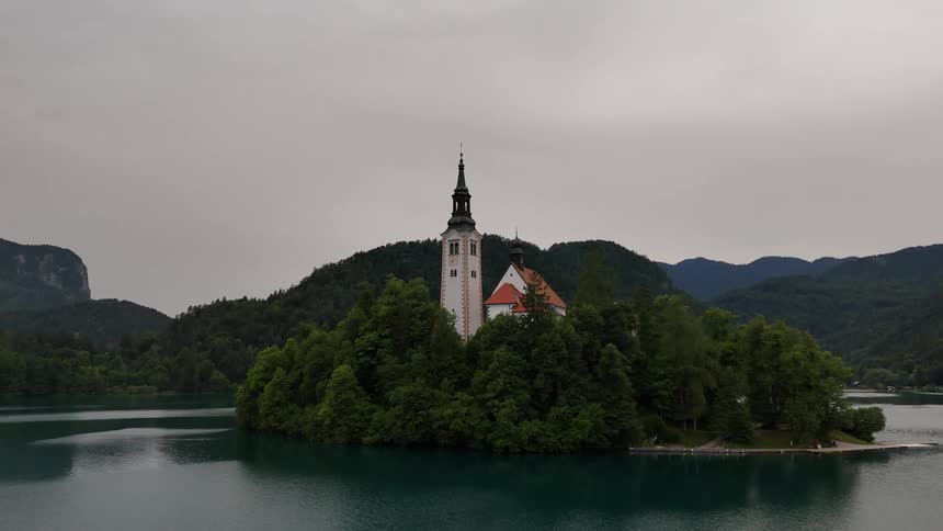 Bled island a tiny tearshaped isle in the middle of lake bled in the northwestern corner of slovenia