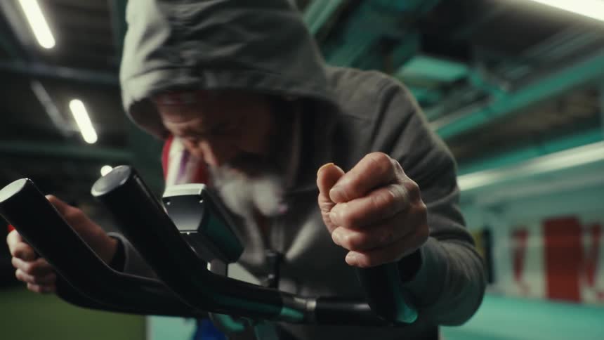 Man with a beard cycling on an exercise bike