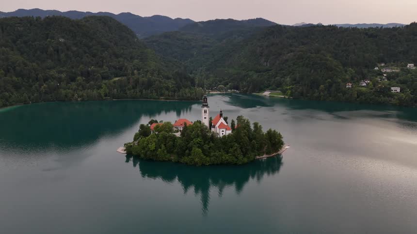 A small island has a tower by the water