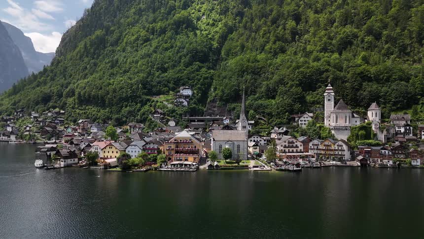 A small town is on the shore of the mountain
