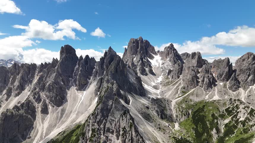 A mountain range with mountains with sharp stone peaks