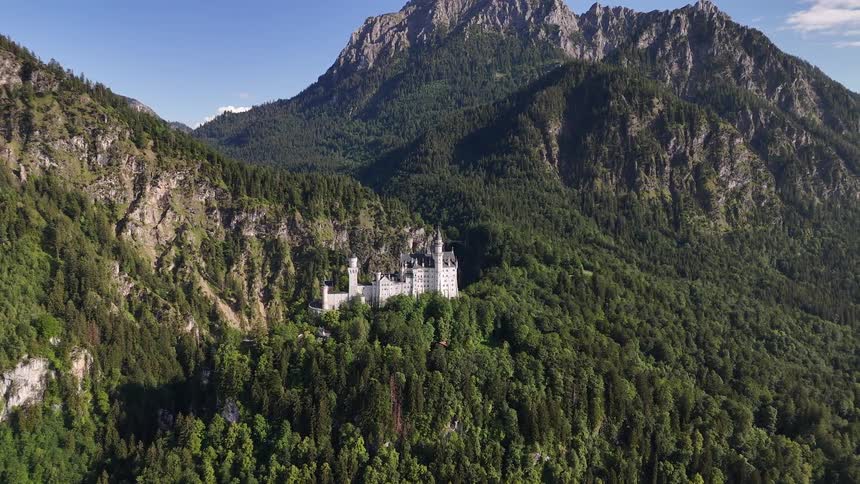 An aerial view of a castle in a mountain area