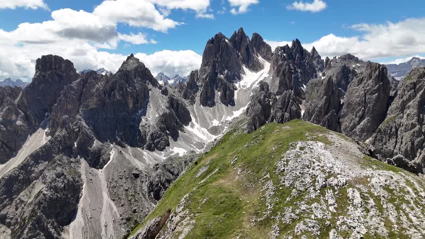Aerial scenery of mountains with sharp cliffs and a sky with clouds