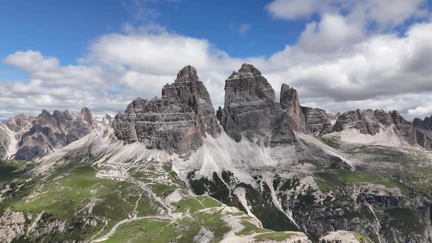 Aerial panorama of mountain ranges with rocky peaks and cliffs