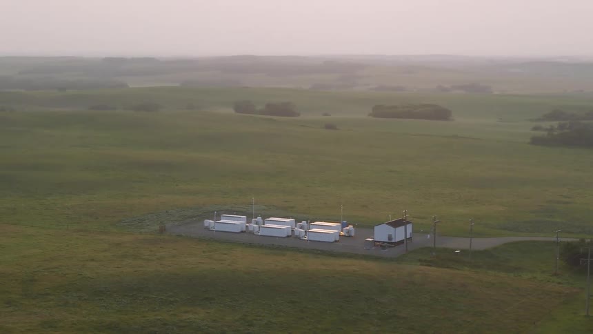 Aerial panorama of a battery generating station on a hazy field