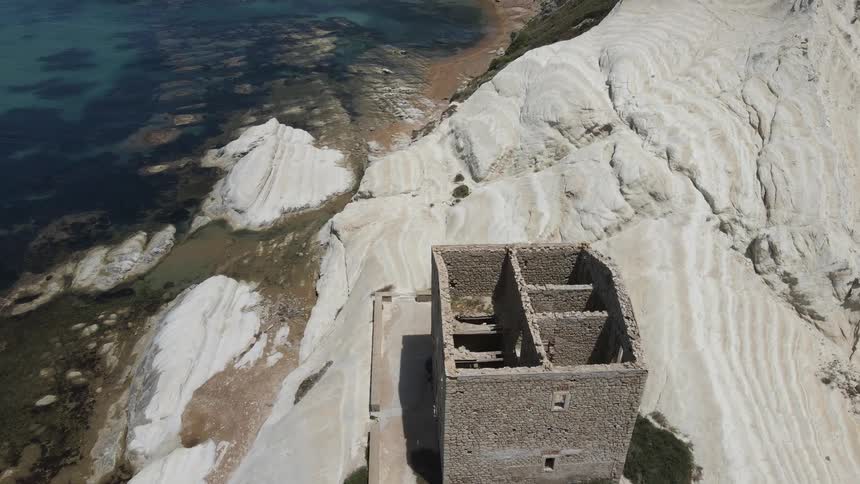 A house in ruins by the sea