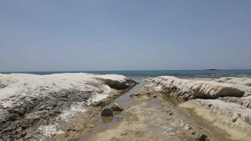 The shore is covered with stone