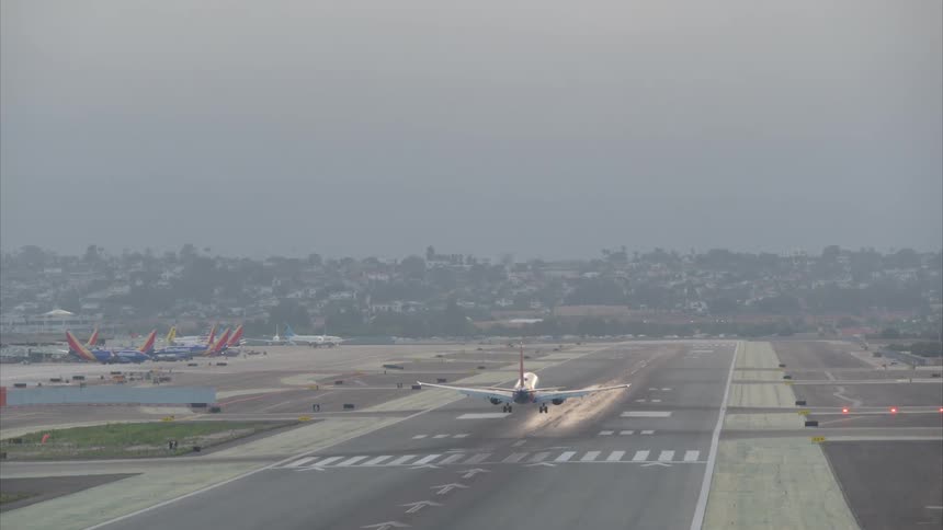A plane lands on the runway