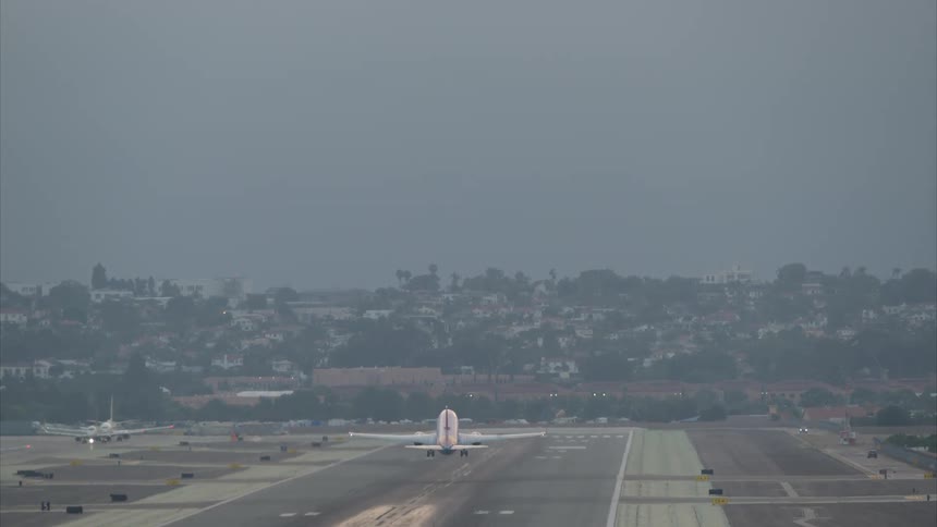 Airplane accelerating and flying on a flight runway
