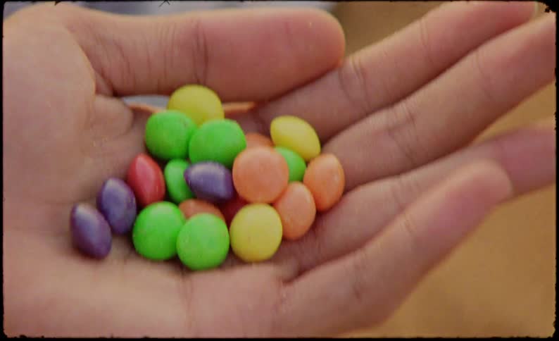 Hand with colorful candies