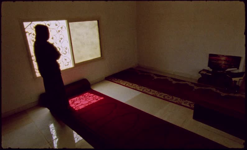 Person inside a room in a prayer position
