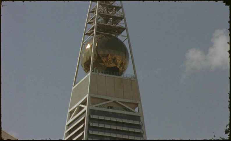 A close up of the architectural details of the al faisaliah tower caught on vintage film