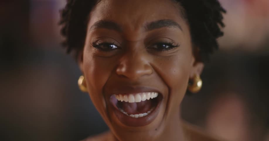 A woman begins laughing