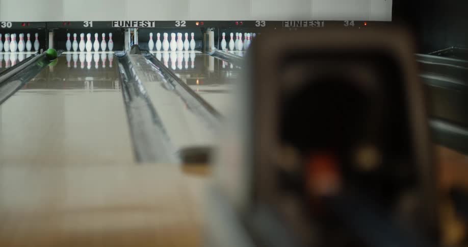 A man throws a gutter ball during the game