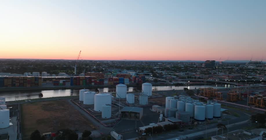 Aerial view of docks with cranes silos and storage containers