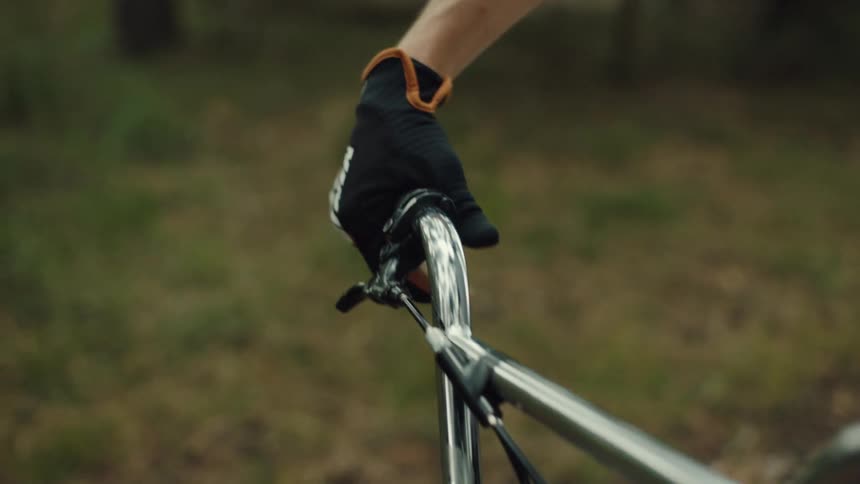 A person is turning the handlebars on his bike