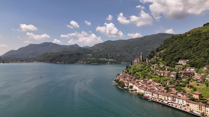 Aerial panorama of houses on the edge of mountains facing the sea
