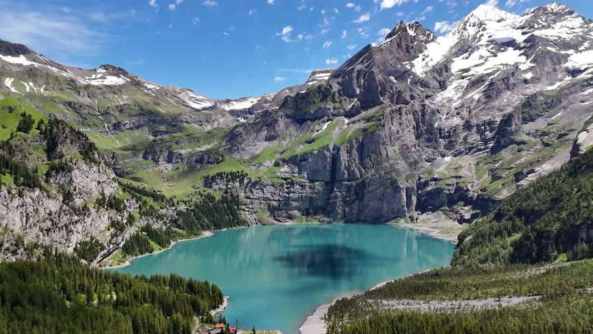A small rural community sits on the bank of a valley lake
