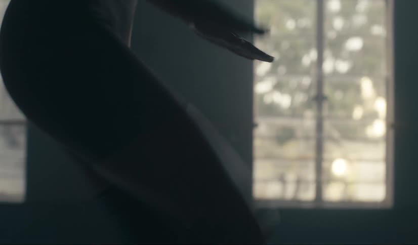 Woman jogs in place in an empty room