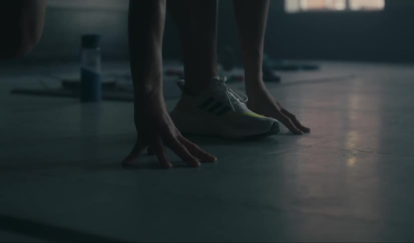 Runner practices their start in an empty room