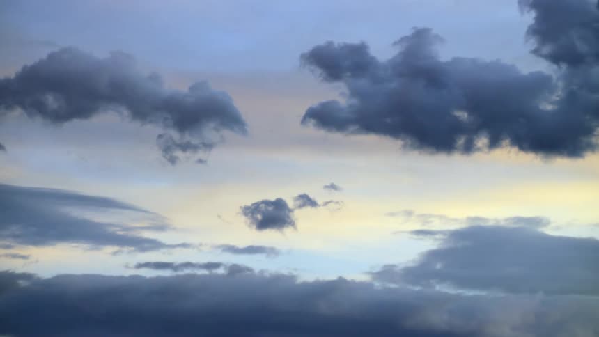 Dark clouds float in the sky