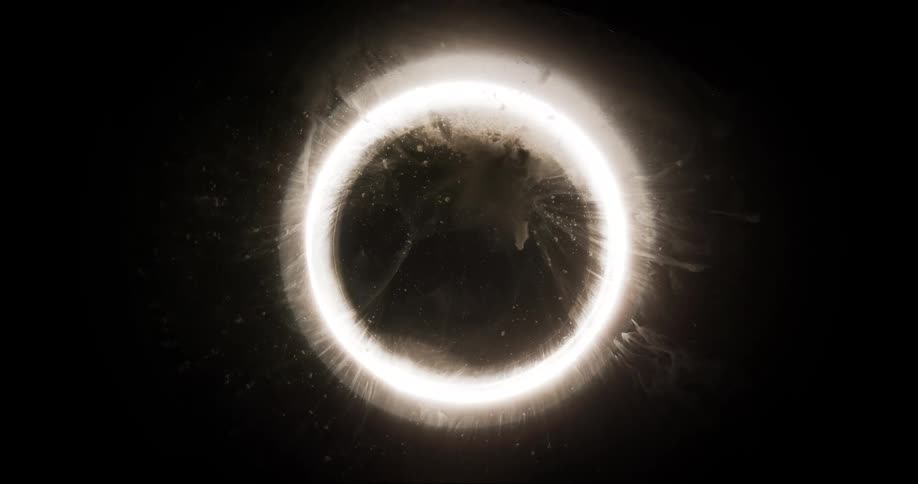 Thin translucent layer diffuses the light from a bright ring floating against a dark background