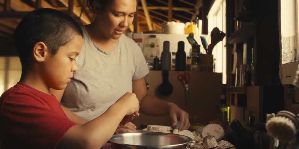 Mother and son cooking together