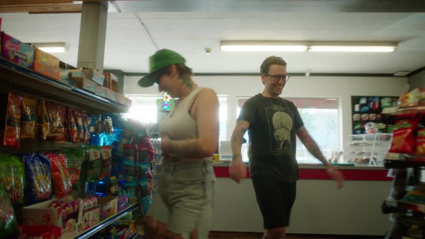 Two customers enter the store and shop