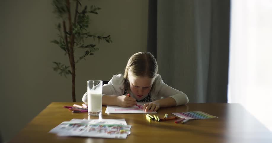 A child is coloring at home