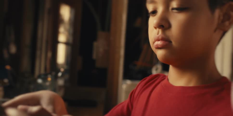 Portrait of a boy helping in the kitchen
