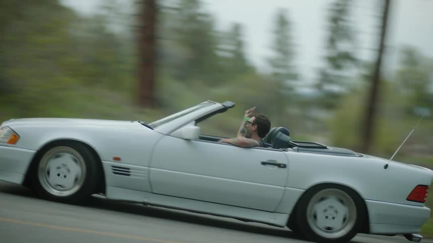 A car drives around the winding road