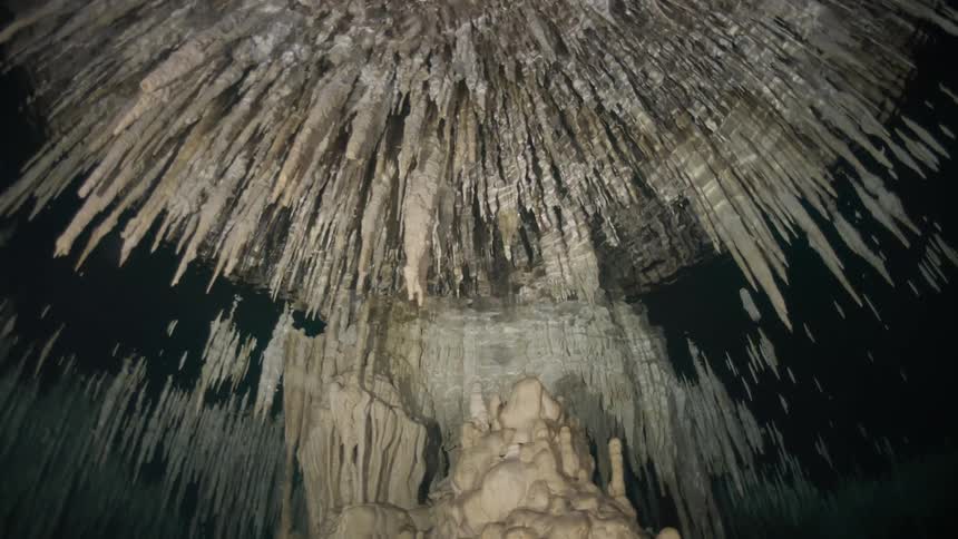 View from inside an underwater cave reflecting its sharp formations