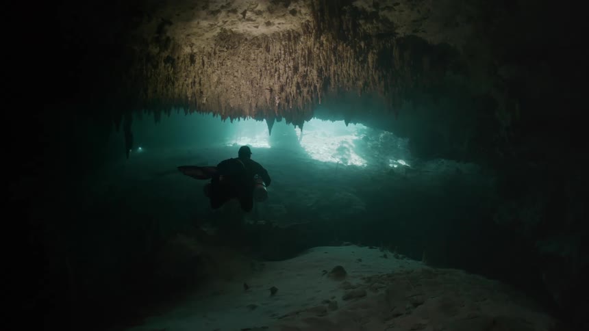 Diver exploring an underwater cave