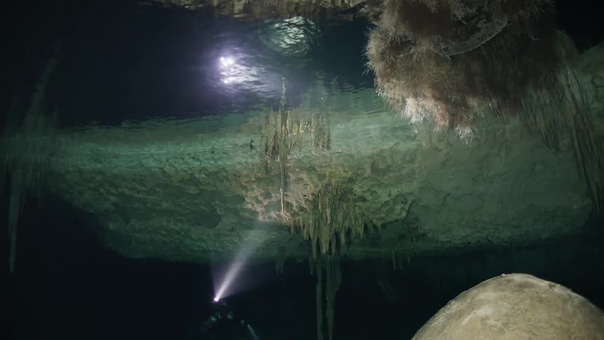 A person who completes diving underwater where there is a cave