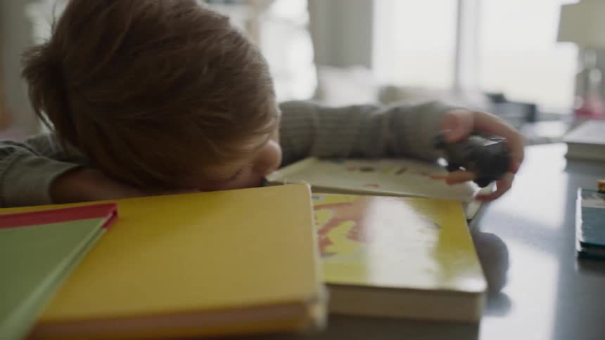 A boy is playing with a toy