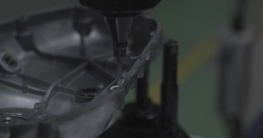 A person is putting glue on an item