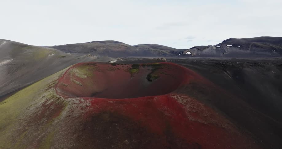 A large crater is at the top of the mountain